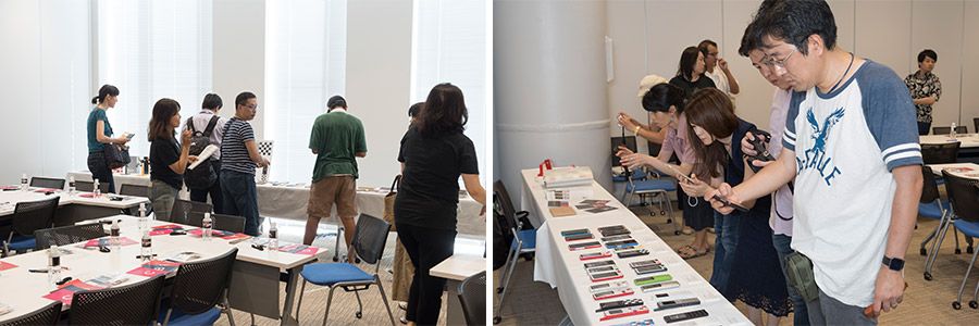 INFOBARファンミーティング新宿での展示物を撮影する参加者たち
